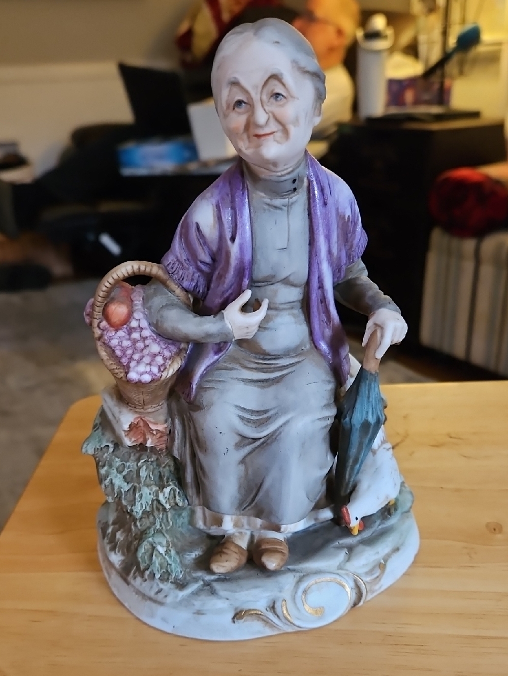 Vintage Ardea or Ardco porcelain figurine of an old woman holding a basket.